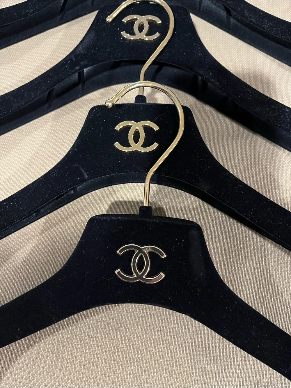 CHANEL Lot of Six Black Flocked Dress/Jacket Hangers with Gold-tone CC Logo
